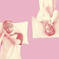 A man and woman sleep in opposite directions against a pink background.