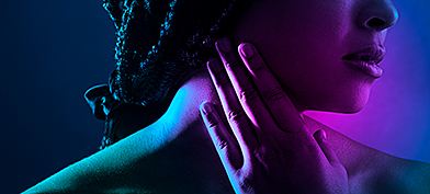 A woman pressing her hand against her sore throat after oral sex.