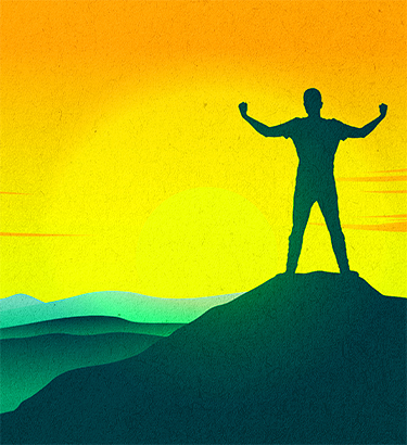 Man-standing-on-mountain-top-arms-up-in-victory