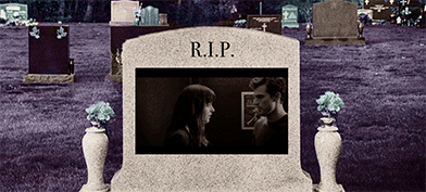 A steamy movie scene plays on a tombstone.