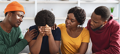 three-people-supporting-surrounding-one-person-in-crisis