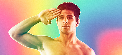 Shirtless-man-soluting-in-front-of-a-rainbow-background
