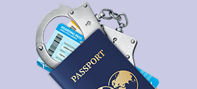 A-passport-lies-on-top-of-a-boarding-pass-and-handcuffs
