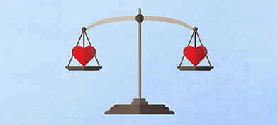 A scale weighs two red hearts, one on each side. 
