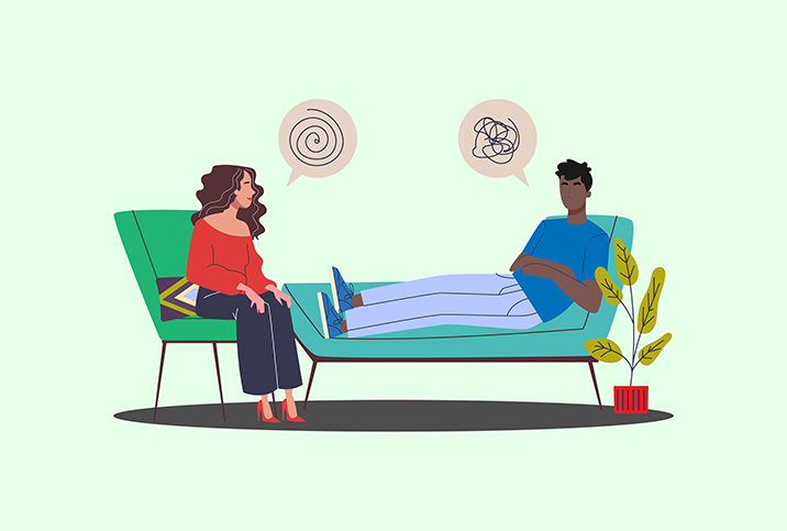 A-man-on-a-couch-talks-to-a-woman-in-a-chair