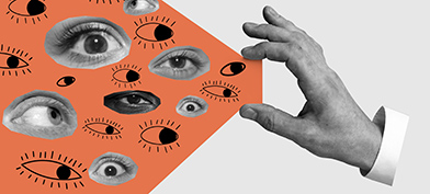 A hand holds between its thumb and pointer fingers an orange beam with eyes inside.