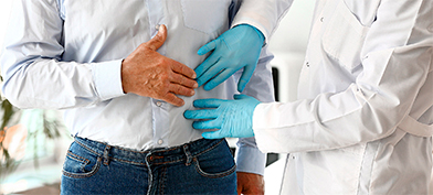 A doctor performs an exam on a male patient.