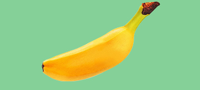 A shrunken, floating banana casts a small shadow on its green background.