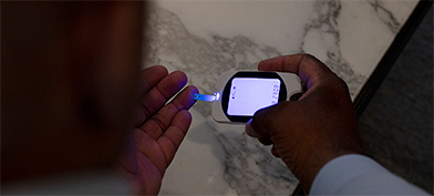 A man with diabetes checks his insulin levels.