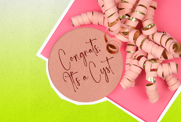 A pink gift sits against a lime green background with a tag that says congrats its a cyst.