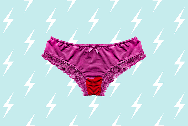 Magenta panties with a red-stained crotch are on top of a light blue background with a repeating lightning pattern.