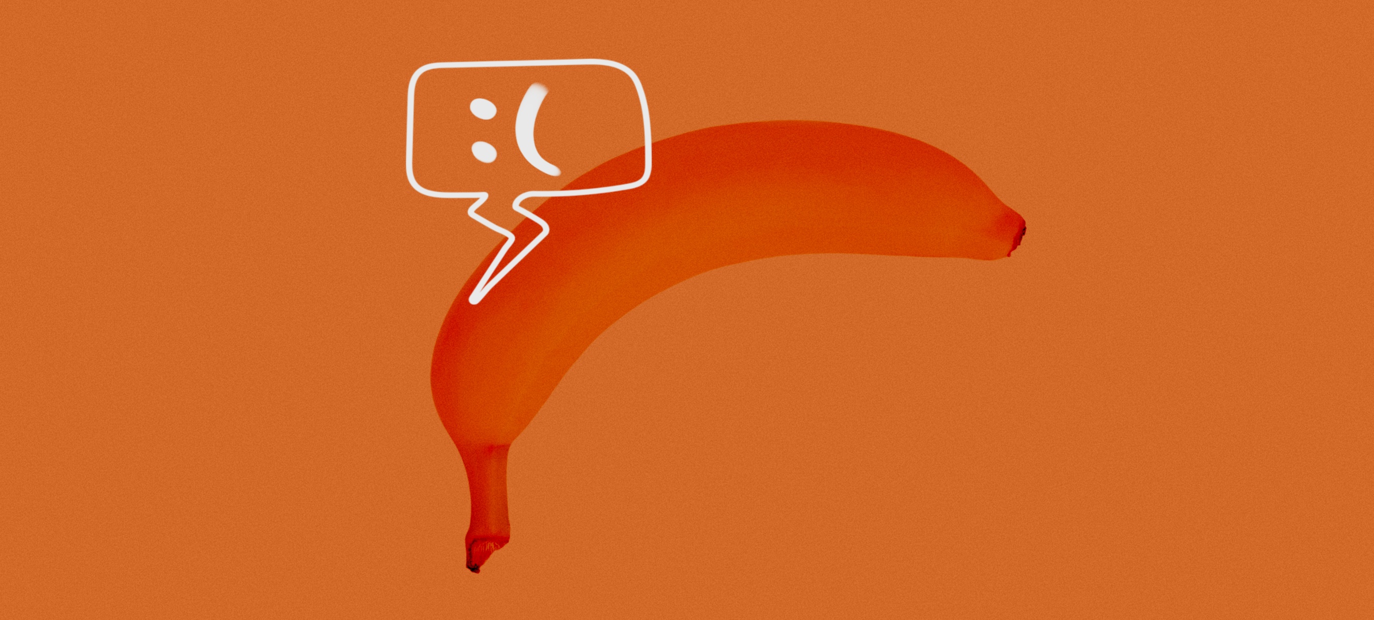 A banana curves downward and a chat bubble above it has a frown emoticon.