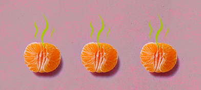 Three unpeeled tangerine halves lay in a row against a pink surface with green smell lines coming from the top.