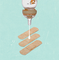 A bottle is upside down dropping breast milk onto a bandaid.