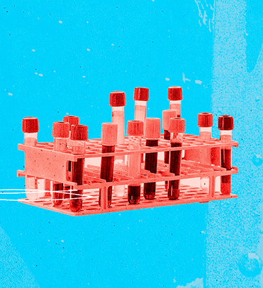 A tray of test tubes with blood in them sit against a light blue background.