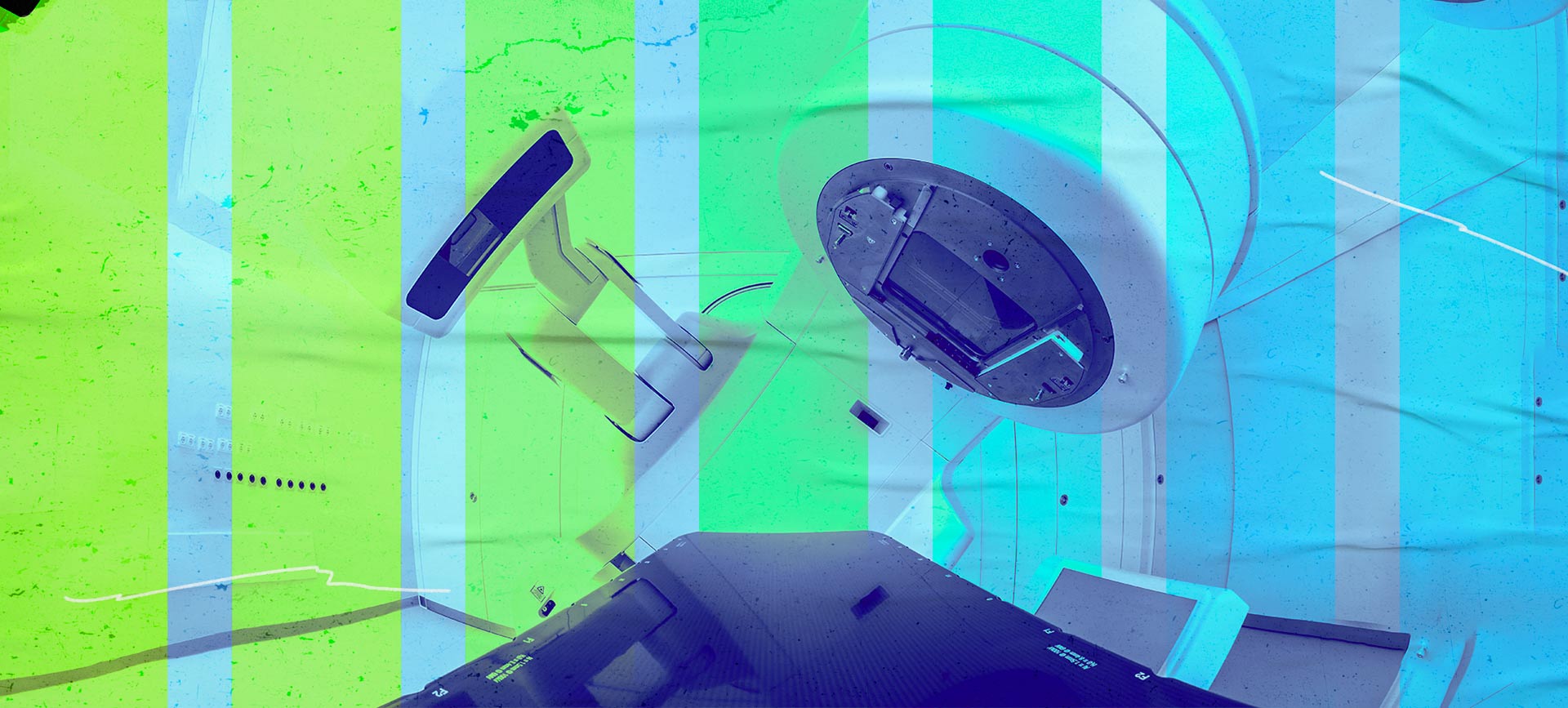 An MRI machine has an overlay of several gradient color bars ranging from yellow to blue.