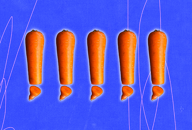 Five carrots are lined up in a row with their tips cut off.