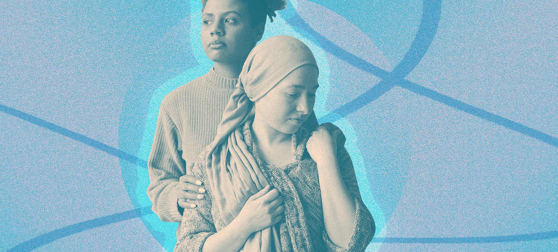 A woman holds the shoulder of another woman in a head wrap. 