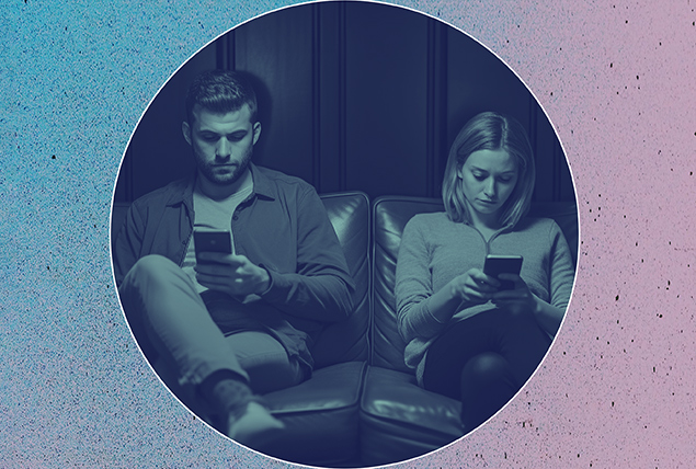 A couple sits on a sofa ignoring each other for their cellphones.