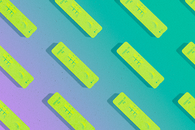 A pattern of lime green COVID-19 antigen rapid tests are against a purple and green background.