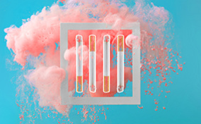 Four-cigarettes-are-in-a-square-in-front-of-a-pink-cloud